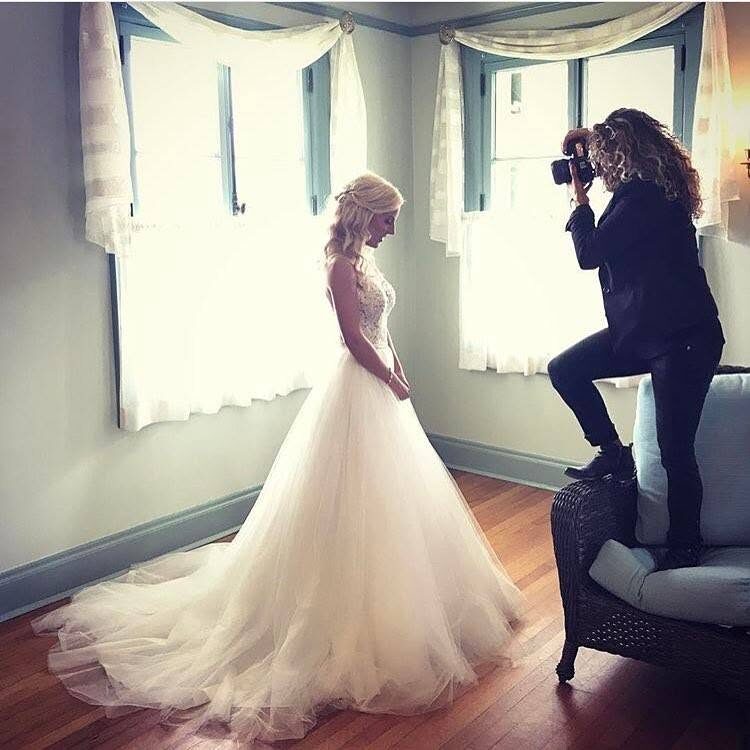 Johnna Brynn photographing a bride in natural window light