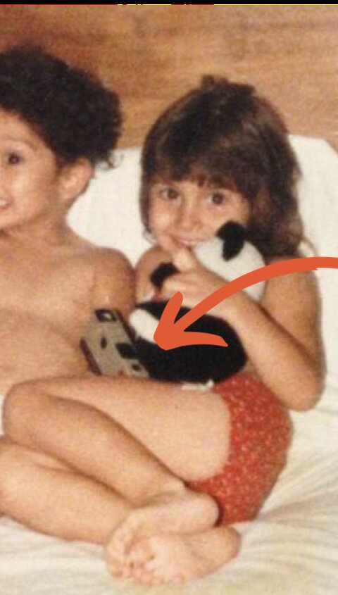 Johnna as a young girl holding her first Kodak Instamatic camera
